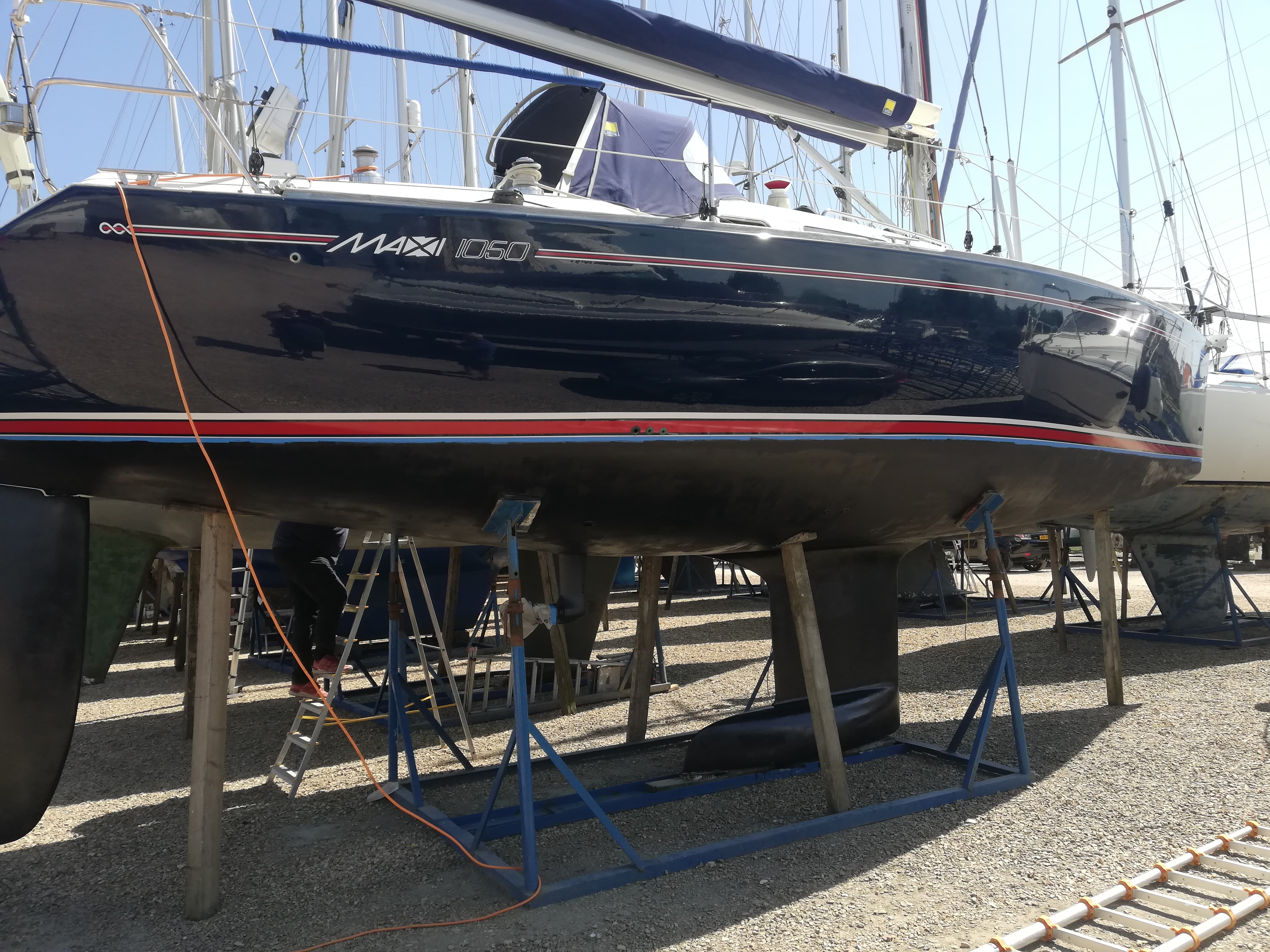 Professional boat polish reflecting surroundings